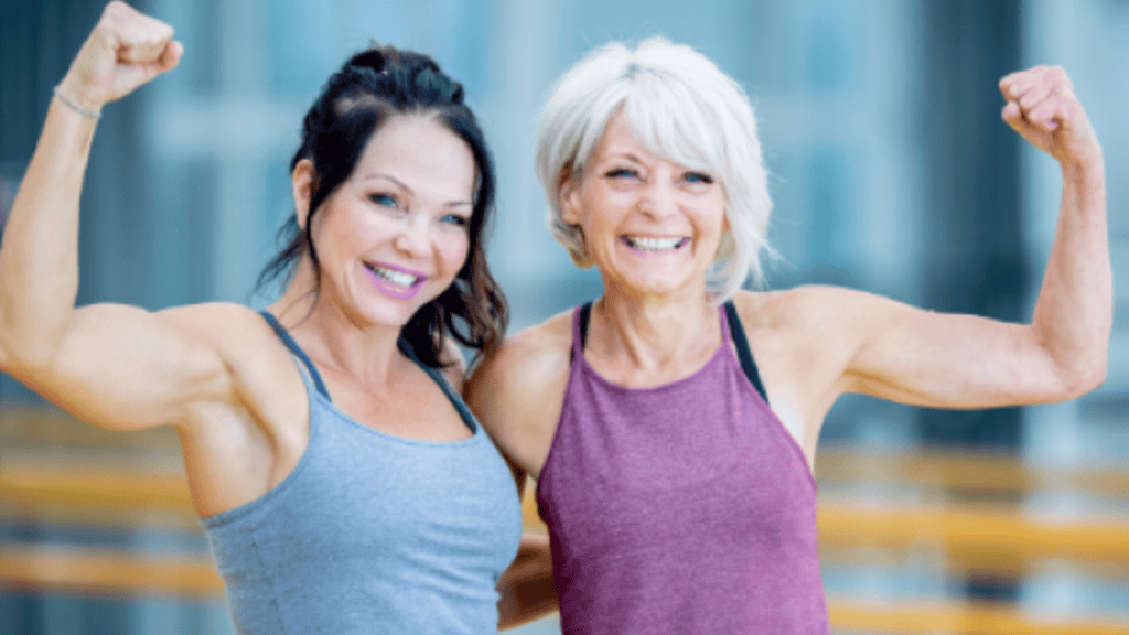 Two elderly women smiling at camera
